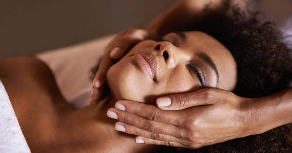 A woman enjoying a popular spa massage treatment at a spa.