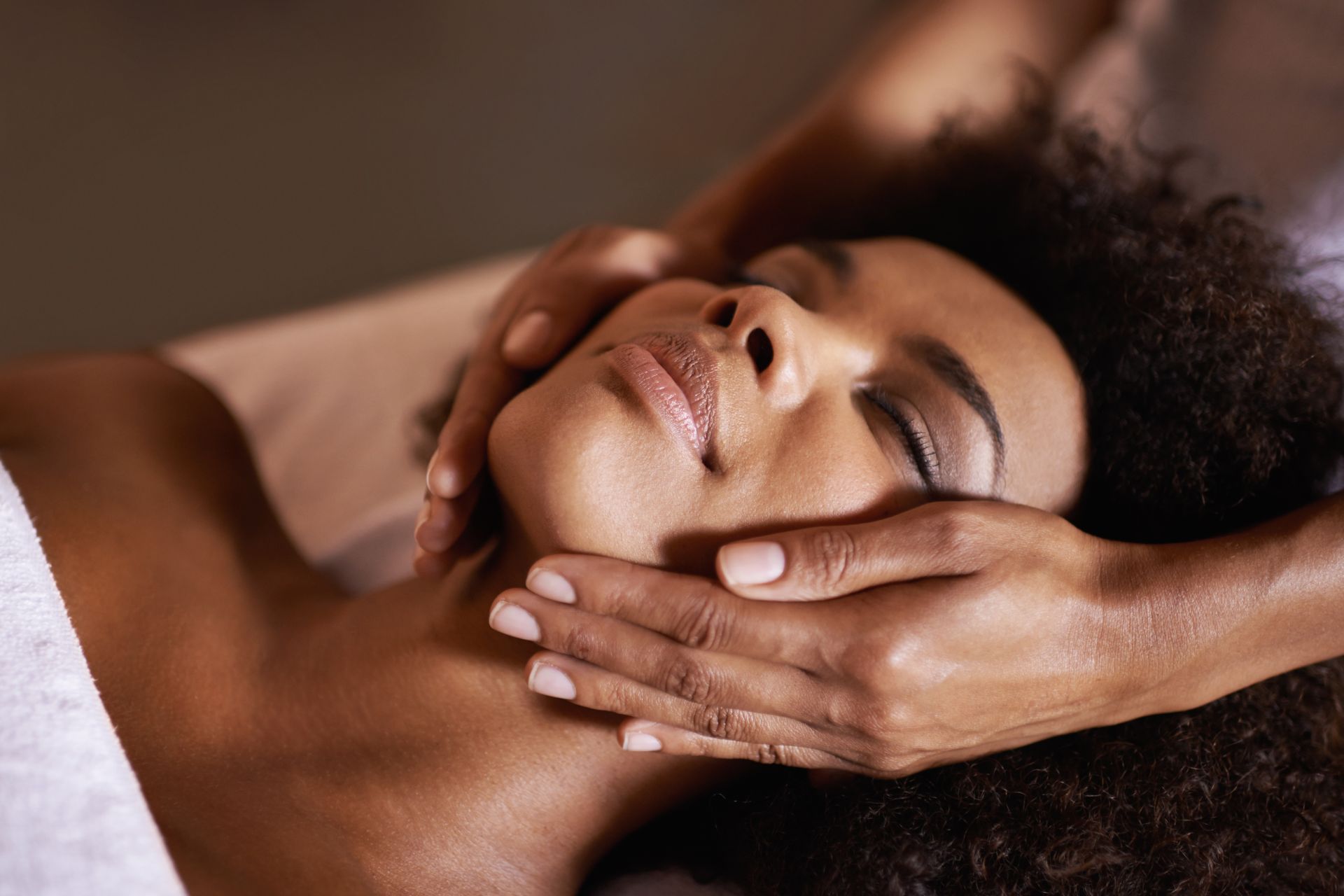 A popular woman receiving a relaxing massage at a spa.