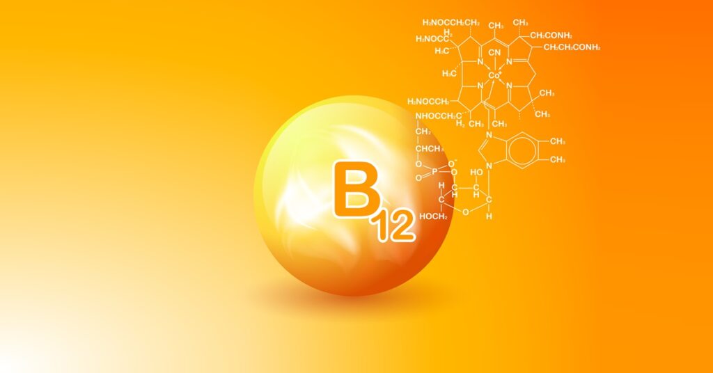 Boost energy with Vitamin B12 isolated on an orange background.