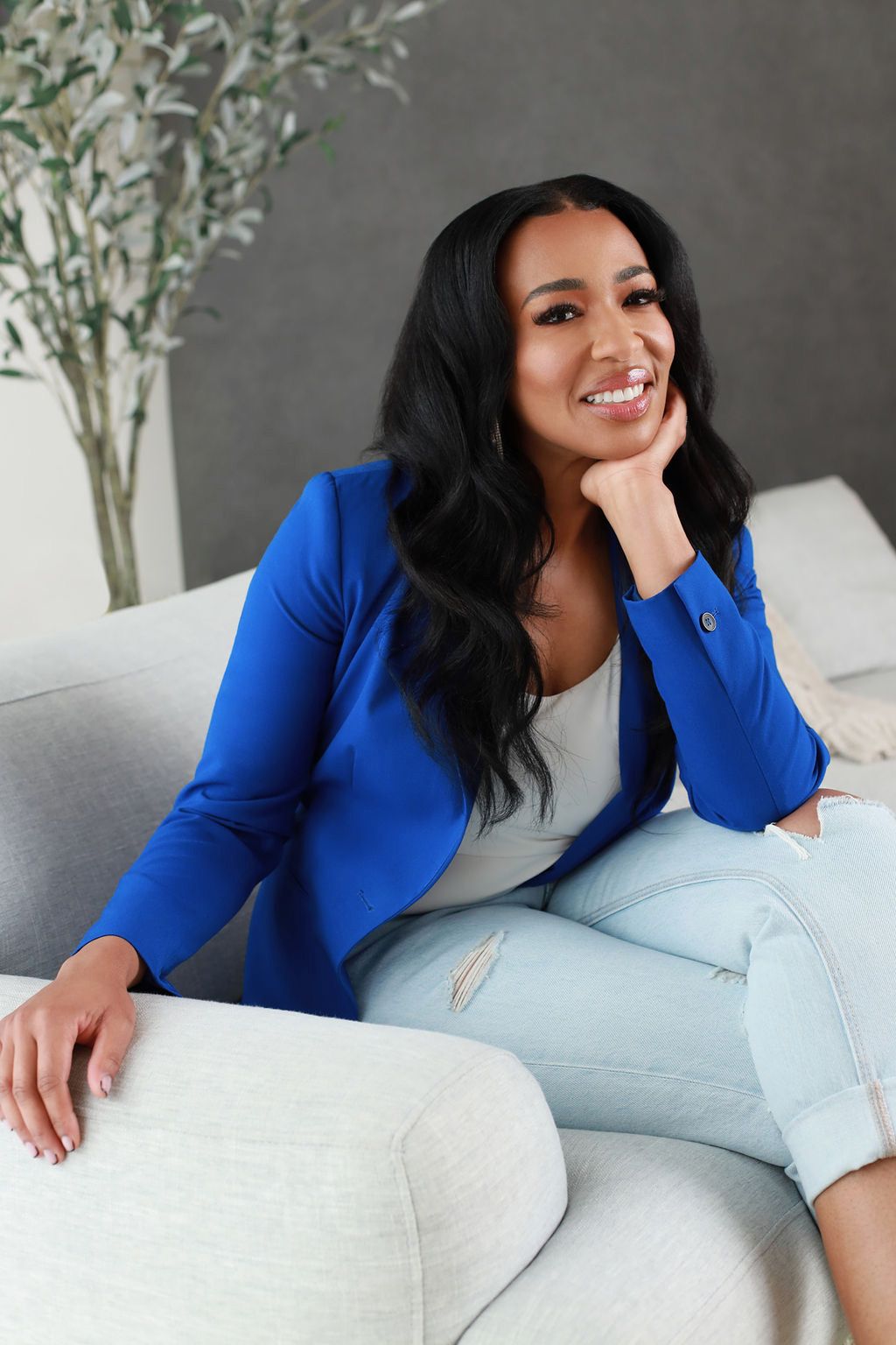 A photograph of Dr. Yolanda Scott MD smiling and sitting in professional attire.