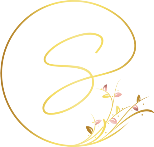 A gold logo with a flower in the middle, symbolizing a welcoming home.