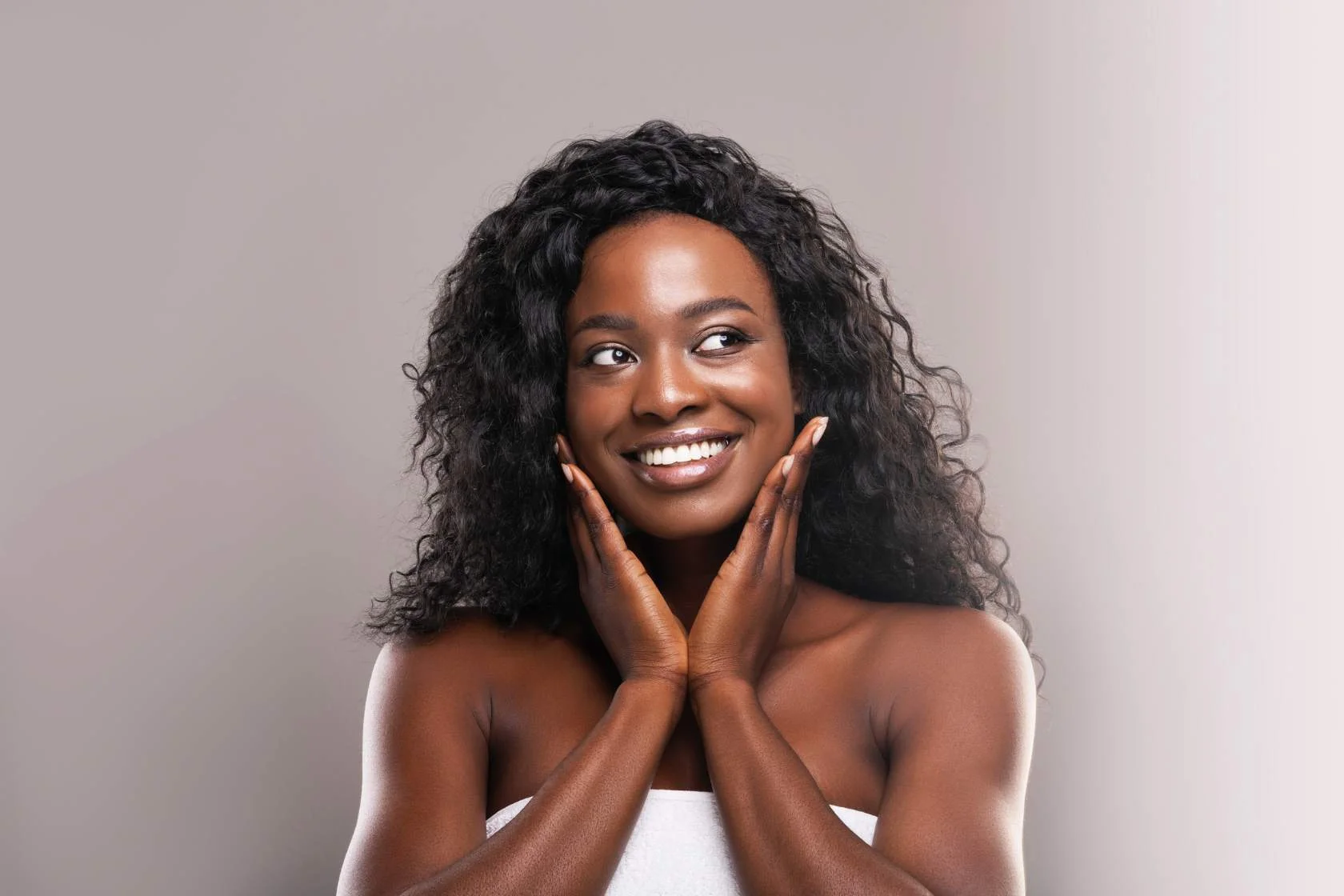 Dr. Scott meets a beautiful black woman posing with her hands on her face.