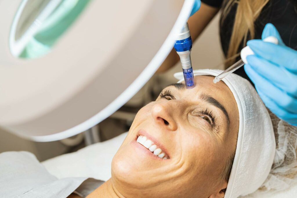 A woman receiving a facial treatment at a beauty salon, benefiting from the expert services provided.