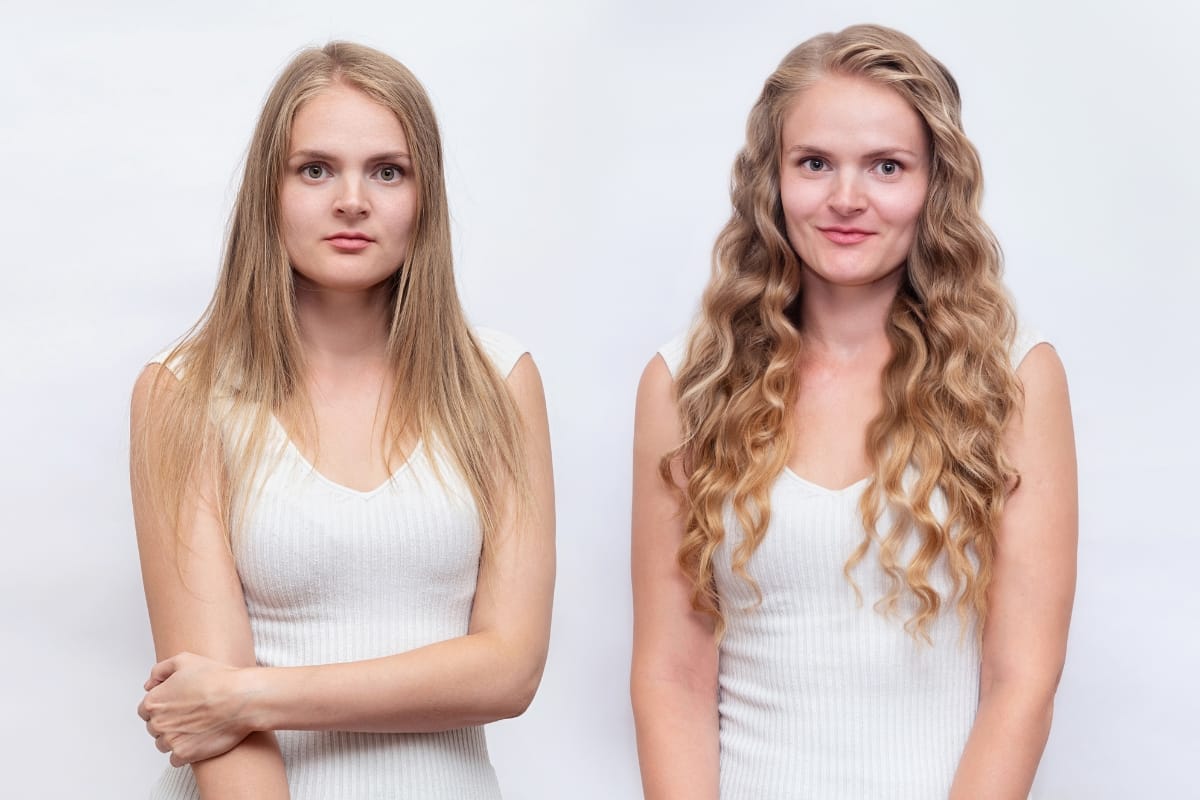 Two women with light skin and long hair stand side by side against a white background, both wearing white sleeveless tops. The woman on the left has straight hair, while the one on the right has wavy hair, possibly enhanced by prp injections.